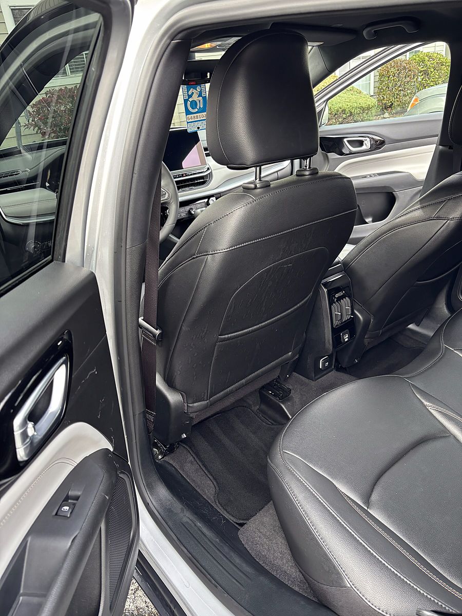 Clean black leather seats in a Jeep